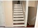 Stairway featuring white-painted stairs with wood treads at 3013 Pommel Ct, Conyers, GA 30013