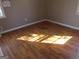 Light-filled bedroom with hardwood floors ready for personalization at 139 Cecelia Cir, Jonesboro, GA 30236