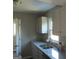 A bright kitchen featuring granite countertops and stainless steel appliances at 139 Cecelia Cir, Jonesboro, GA 30236