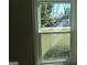 Exterior view from a window, looking out onto the front yard and street at 139 Cecelia Cir, Jonesboro, GA 30236