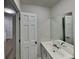 Double vanity bathroom with a large mirror and updated fixtures at 6146 Douglas Manor Ct, Douglasville, GA 30134