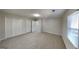 Well-lit bedroom with carpet, double closets, and a window with blinds at 6146 Douglas Manor Ct, Douglasville, GA 30134