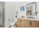 Bright bathroom features a double vanity, framed mirror, and modern fixtures at 3939 Hamilton Mill Rd, Buford, GA 30519
