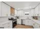 Well-lit kitchen featuring stainless steel appliances, modern countertops, and white cabinets at 3939 Hamilton Mill Rd, Buford, GA 30519