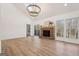 Spacious living room featuring a fireplace, large windows, and vaulted ceilings at 3939 Hamilton Mill Rd, Buford, GA 30519