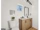 Bathroom featuring a modern vanity with double sinks and stylish lighting at 3939 Hamilton Mill Rd, Buford, GA 30519