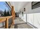 Inviting front porch showcasing wood columns and railing, with space for seating at 3939 Hamilton Mill Rd, Buford, GA 30519