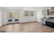 Modern kitchen featuring stainless steel appliances, grey cabinets, wood countertop and view of the backyard at 3939 Hamilton Mill Rd, Buford, GA 30519