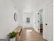 Bright entryway with a wood bench, decorative mirror, and view to the front door at 3939 Hamilton Mill Rd, Buford, GA 30519