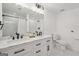 Bathroom with double vanity with carrara marble countertop and a shower tub combination at 3939 Hamilton Mill Rd, Buford, GA 30519