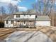 Charming exterior showcasing a covered front porch, a well-kept yard, and a welcoming entrance at 3939 Hamilton Mill Rd, Buford, GA 30519