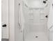 Clean, bright walk-in shower with white tile and black shower head at 3939 Hamilton Mill Rd, Buford, GA 30519