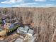 Aerial perspective of the house with mature trees and a view of the surrounding neighborhood at 3939 Hamilton Mill Rd, Buford, GA 30519