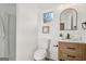 Bright bathroom with a modern vanity, framed mirror, and black hardware at 3939 Hamilton Mill Rd, Buford, GA 30519