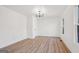 A bright, airy bedroom featuring new floors, a window, and neutral paint at 3939 Hamilton Mill Rd, Buford, GA 30519