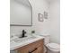 Bathroom featuring a rustic vanity and modern black hardware at 3939 Hamilton Mill Rd, Buford, GA 30519