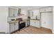 Modern kitchen featuring stainless steel appliances, grey cabinets, and light wood countertops at 3939 Hamilton Mill Rd, Buford, GA 30519