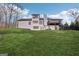 Expansive green backyard features a raised deck, perfect for entertaining and enjoying the natural surroundings at 3939 Hamilton Mill Rd, Buford, GA 30519