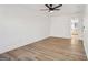 Bright, open bedroom featuring a ceiling fan and wood-look flooring at 3939 Hamilton Mill Rd, Buford, GA 30519