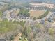 Picture of residential area with many homes near a large open field and wooded area at 151 Brasch Park Dr, Grantville, GA 30220