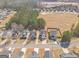 Aerial view of the homes in a suburban community, showcasing streetscape, yards and surrounding environment at 151 Brasch Park Dr, Grantville, GA 30220