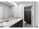 Bright bathroom features dual sinks, granite countertops and a shower-tub combination at 151 Brasch Park Dr, Grantville, GA 30220