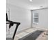 This is an image of a bedroom including a treadmill, free weights, a window and a white wall at 151 Brasch Park Dr, Grantville, GA 30220