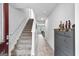 Inviting entryway with staircase and stylish storage cabinet and a view of the living space at 151 Brasch Park Dr, Grantville, GA 30220