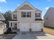 Charming two-story home with a two-car garage, neutral siding, and landscaped yard at 151 Brasch Park Dr, Grantville, GA 30220