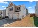 View of home's side and backyard featuring a large driveway and a well-maintained lawn at 151 Brasch Park Dr, Grantville, GA 30220