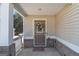 Charming front porch with decorative wreath and welcoming 