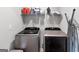 Practical laundry room with modern washer and dryer at 151 Brasch Park Dr, Grantville, GA 30220