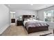 Spacious main bedroom boasts a large window, carpet flooring and side tables at 151 Brasch Park Dr, Grantville, GA 30220