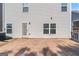 Backyard with a concrete patio and the view of the siding and windows of the home at 151 Brasch Park Dr, Grantville, GA 30220