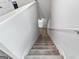 Carpeted stairs lead to a bright, neutral-toned hallway, creating a seamless transition between floors at 151 Brasch Park Dr, Grantville, GA 30220