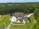 Expansive aerial view of home on large lot with in-ground pool and surrounding greenery at 535 Waters Way, Fayetteville, GA 30215