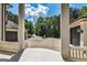 View of circular driveway with fountain and mature trees, taken from covered porch area at 535 Waters Way, Fayetteville, GA 30215