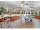 Sunroom with a ping pong table, bar seating, fan and windows overlooking the backyard at 2282 Forest Dr, Jonesboro, GA 30236