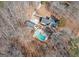 Aerial view of house, pool, and surrounding landscape at 130 Seneca Pl, Fayetteville, GA 30215
