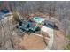 House with attached garage and inground pool; surrounded by trees at 130 Seneca Pl, Fayetteville, GA 30215