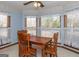Bright dining area with wood table and chairs, offering a view of the backyard at 130 Seneca Pl, Fayetteville, GA 30215