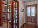 Bright entryway with hardwood floors and access to an office at 130 Seneca Pl, Fayetteville, GA 30215