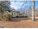 Yellow house with wrap around porch and large backyard at 130 Seneca Pl, Fayetteville, GA 30215