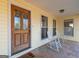 Inviting front porch with rocking chairs and a wood door at 130 Seneca Pl, Fayetteville, GA 30215