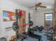 Home gym with weight bench, barbell, and other exercise equipment at 130 Seneca Pl, Fayetteville, GA 30215