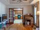 Living room with hardwood floors, a view of the kitchen, and a wooden desk at 130 Seneca Pl, Fayetteville, GA 30215