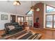 Living room with brick fireplace, hardwood floors, and large windows at 130 Seneca Pl, Fayetteville, GA 30215