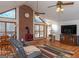 Spacious living room with brick fireplace, vaulted ceilings, and hardwood floors at 130 Seneca Pl, Fayetteville, GA 30215