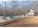 Inviting pool area with patio furniture and large yard at 130 Seneca Pl, Fayetteville, GA 30215