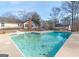 Inviting inground pool with surrounding patio at 130 Seneca Pl, Fayetteville, GA 30215